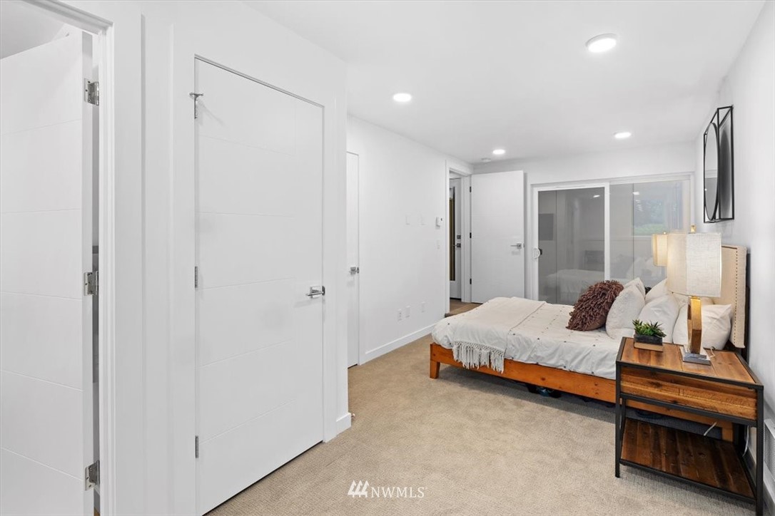 1271 North 145th Street Seattle, WA 98133 - Photo 5 of 32 a bedroom with a bed and a walk in closet