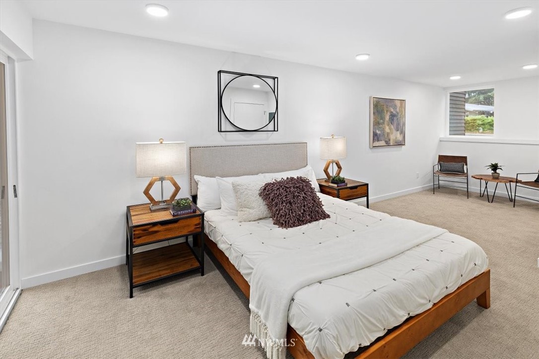 1271 North 145th Street Seattle, WA 98133 - Photo 6 of 32 a bedroom with a bed and wooden floor
