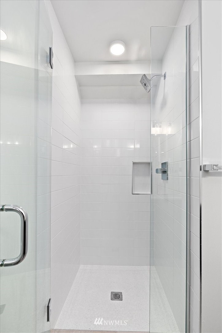 1271 North 145th Street Seattle, WA 98133 - Photo 10 of 32 a bathroom with a shower and a tub