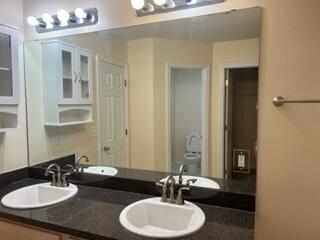 543 Tikell Drive Crestview, FL 32536 - Photo 14 of 27 a bathroom with a double vanity sink and a mirror