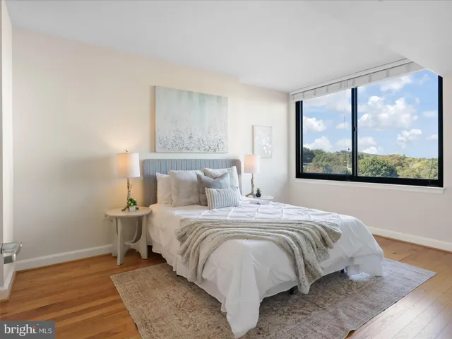 a large white bed in a white room