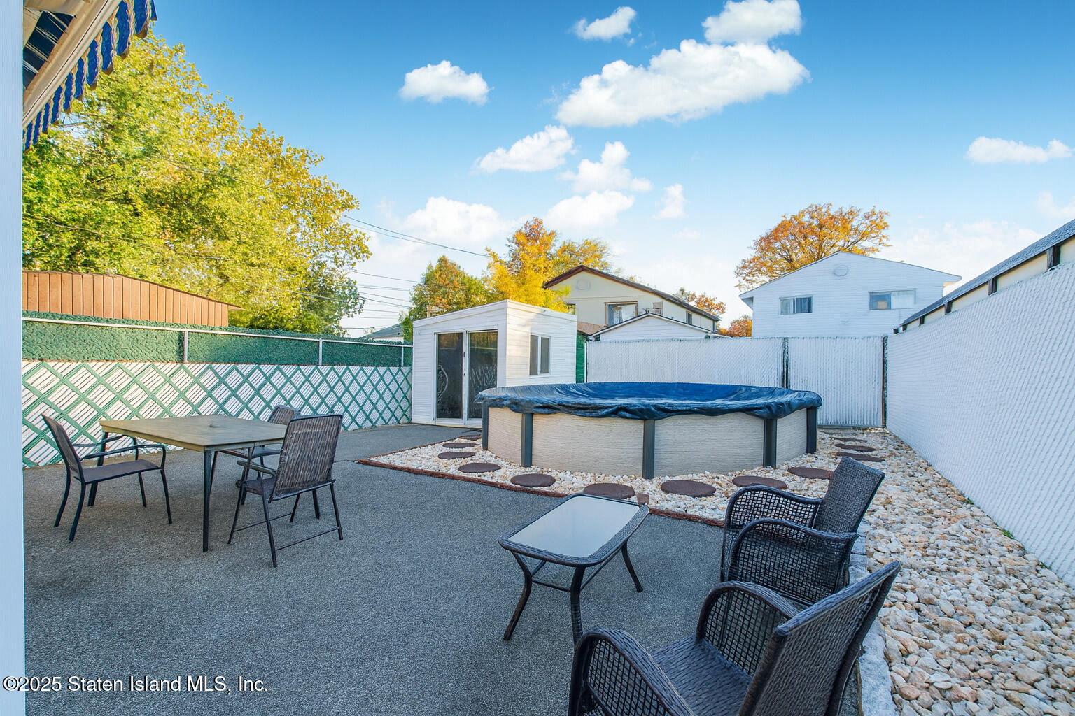 154 Merrill Avenue Staten Island, NY 10314 - Photo 18 of 21 a view of a patio with table and chairs and potted plants