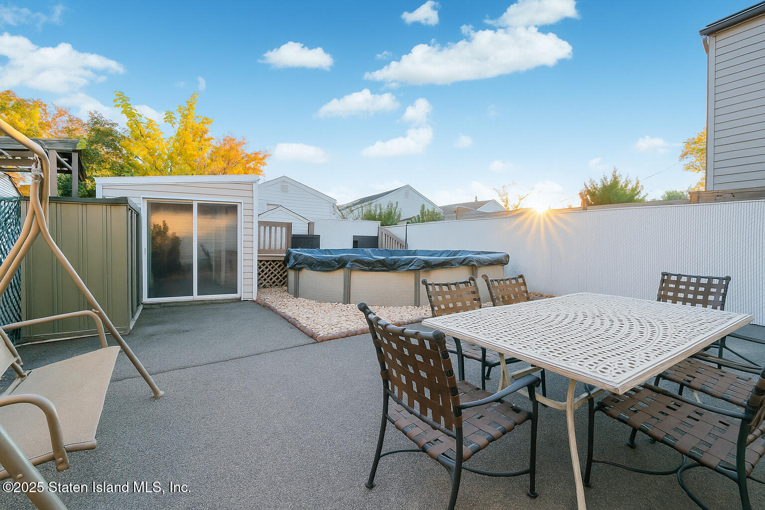 154 Merrill Avenue Staten Island, NY 10314 - Photo 19 of 21 a view of a patio with a table and chairs
