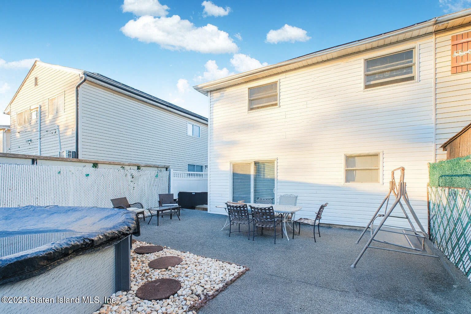 154 Merrill Avenue Staten Island, NY 10314 - Photo 20 of 21 a living room with furniture and a dining table