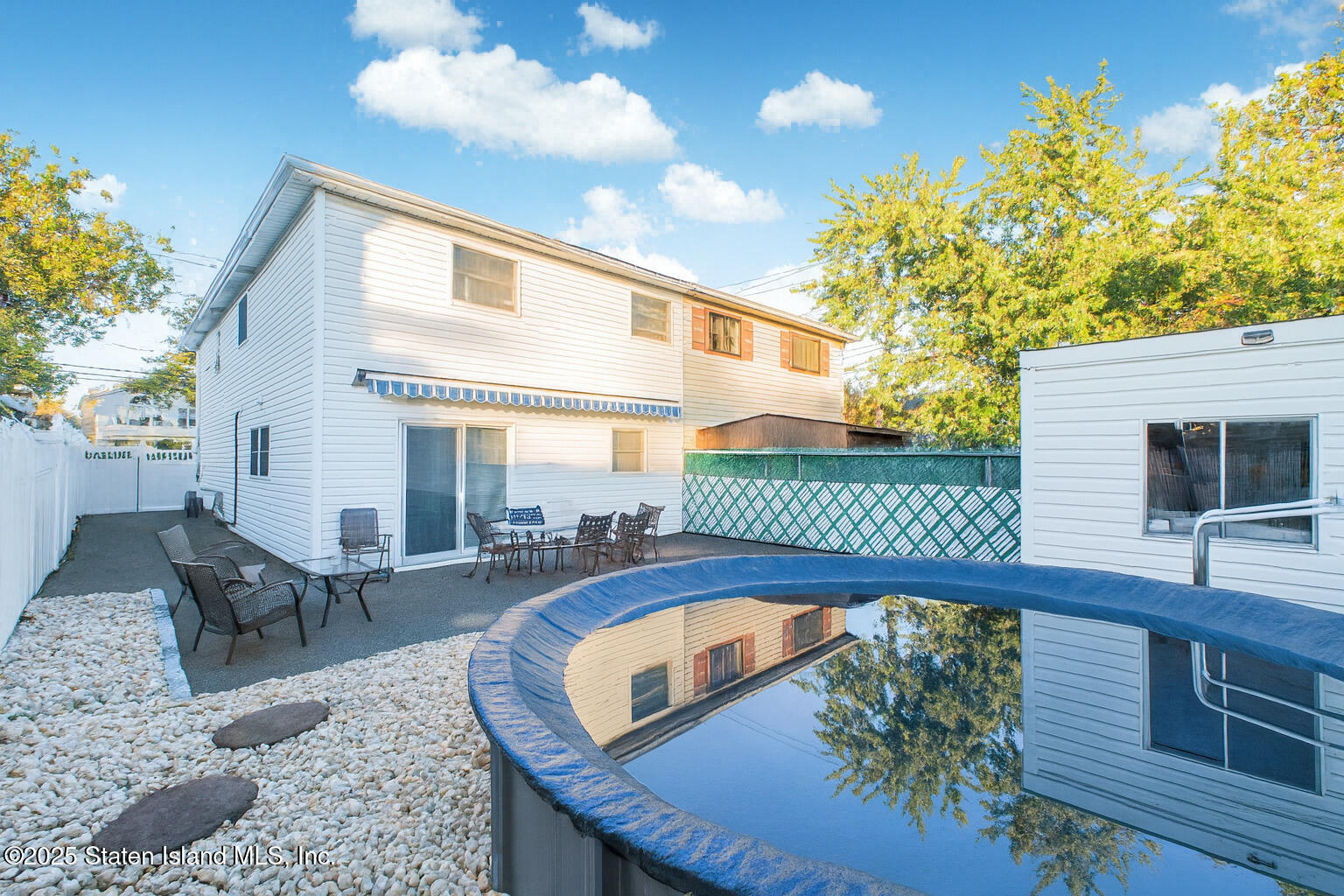 154 Merrill Avenue Staten Island, NY 10314 - Photo 21 of 21 a view of a house with a swimming pool