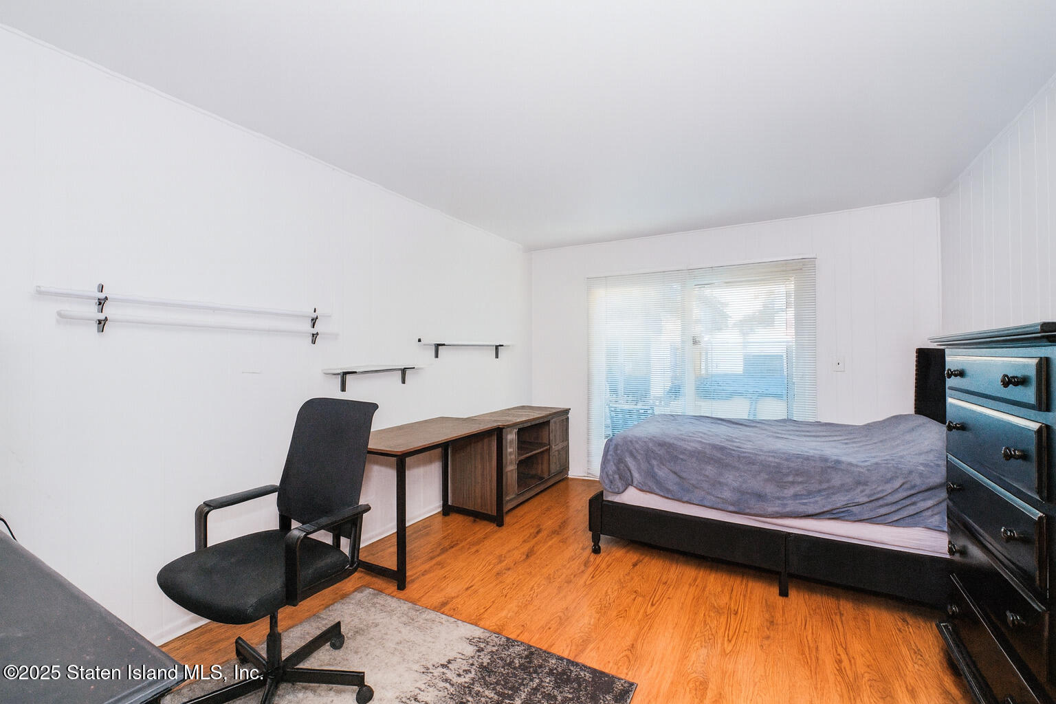 154 Merrill Avenue Staten Island, NY 10314 - Photo 4 of 21 a bedroom with furniture and a window