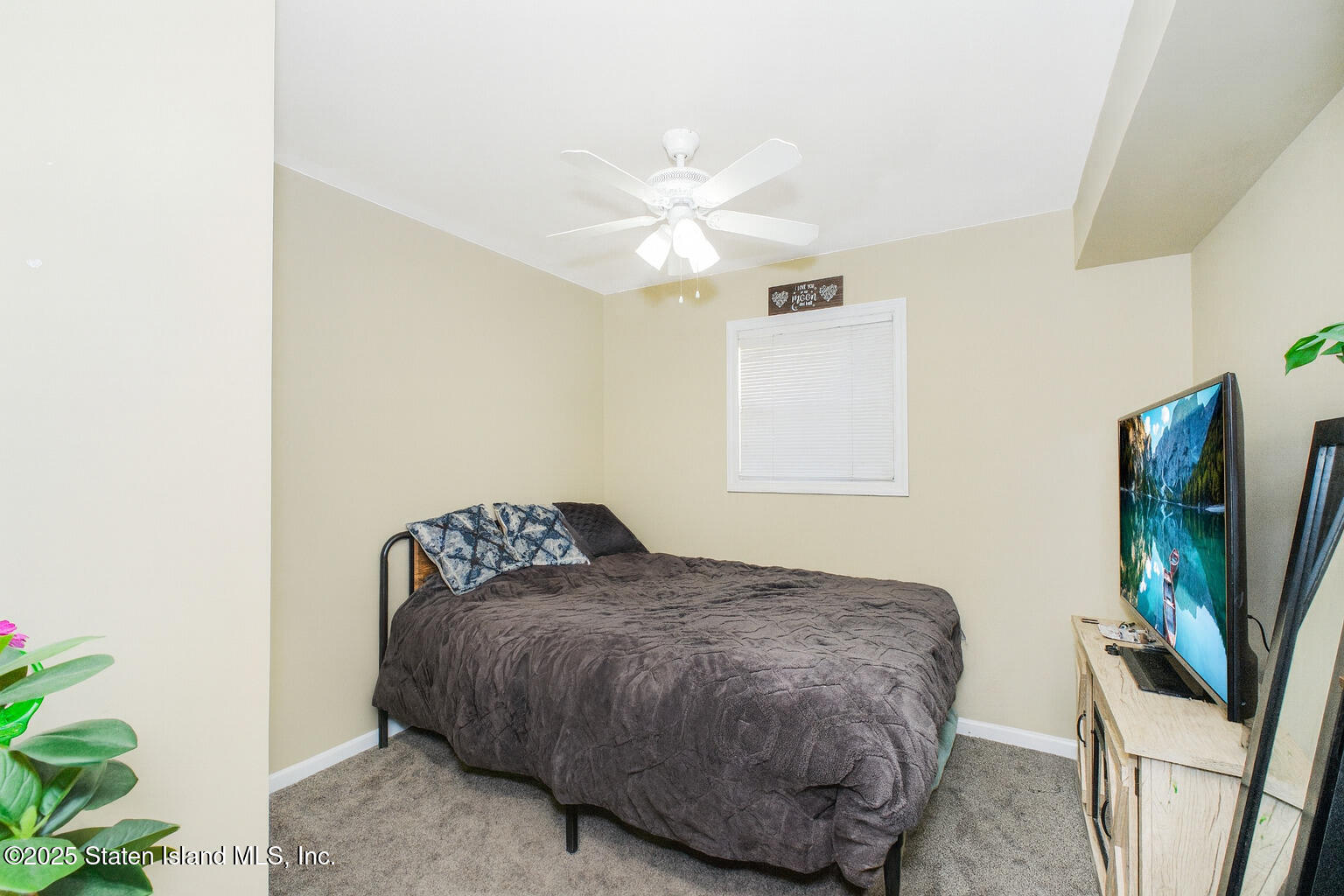 154 Merrill Avenue Staten Island, NY 10314 - Photo 5 of 21 a bedroom with a bed and a flat screen tv