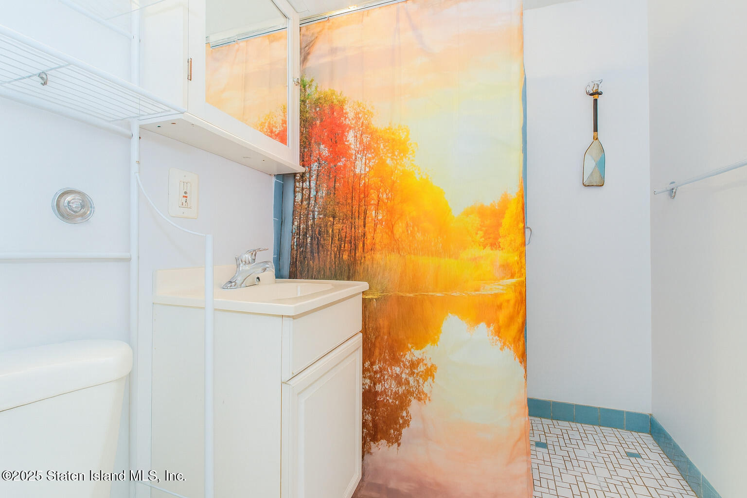 154 Merrill Avenue Staten Island, NY 10314 - Photo 6 of 21 a bathroom with a sink and a mirror