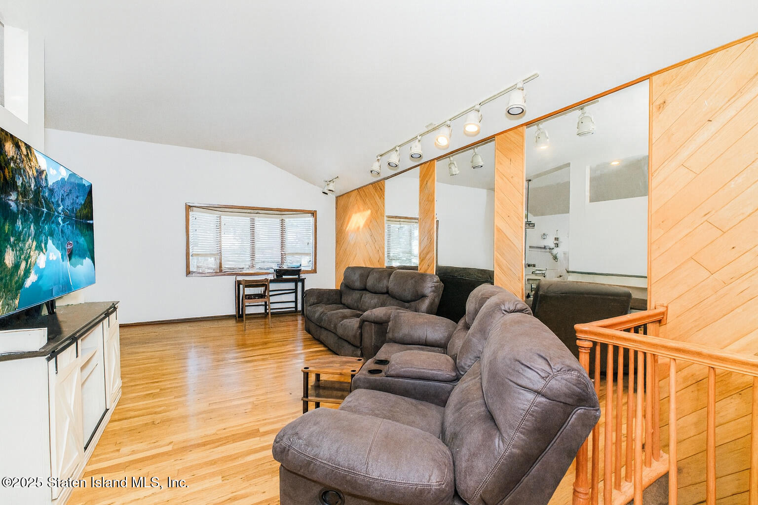 154 Merrill Avenue Staten Island, NY 10314 - Photo 7 of 21 a living room with furniture and a flat screen tv
