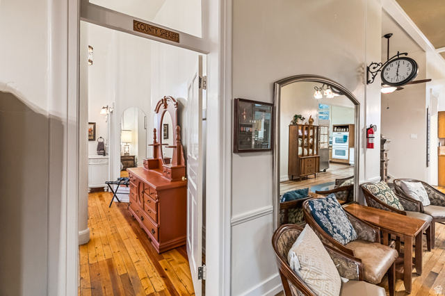 21 North Main Street Kingston, UT 84743 - Photo 60 of 107 Hallway with arched walkways and light wood-style floors