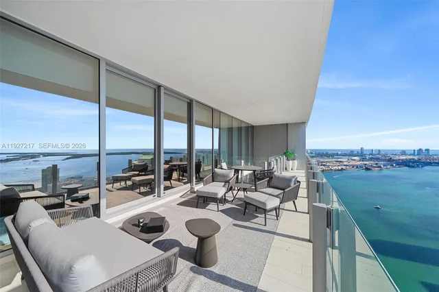 a view of swimming pool with outdoor seating