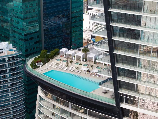 a table with wine bottles and glasses on it