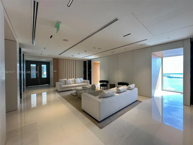 a black and white photo of a living room