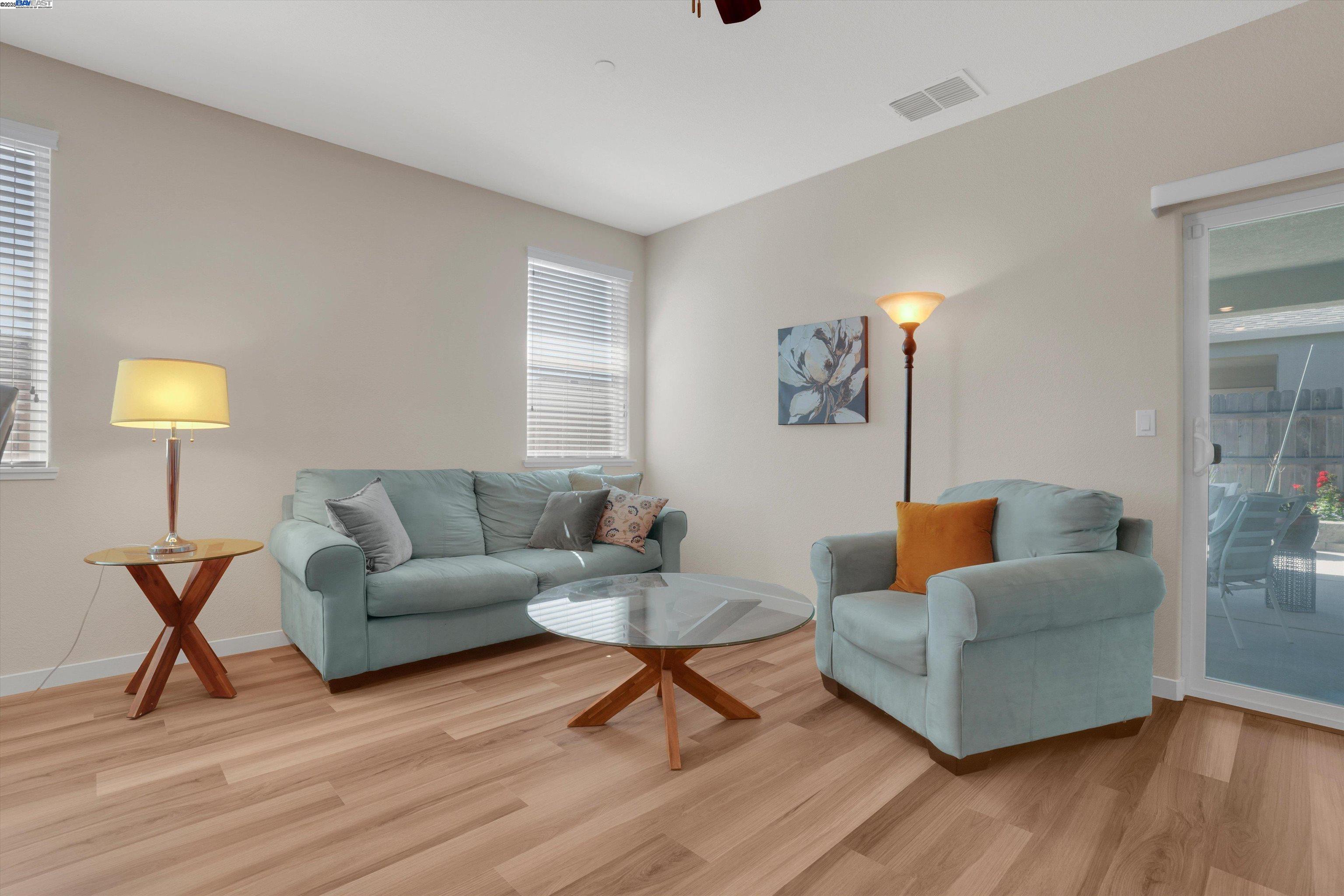 2211 Lavender Place Rio Vista, CA 94571 - Photo 18 of 36 a living room with furniture and a wooden floor
