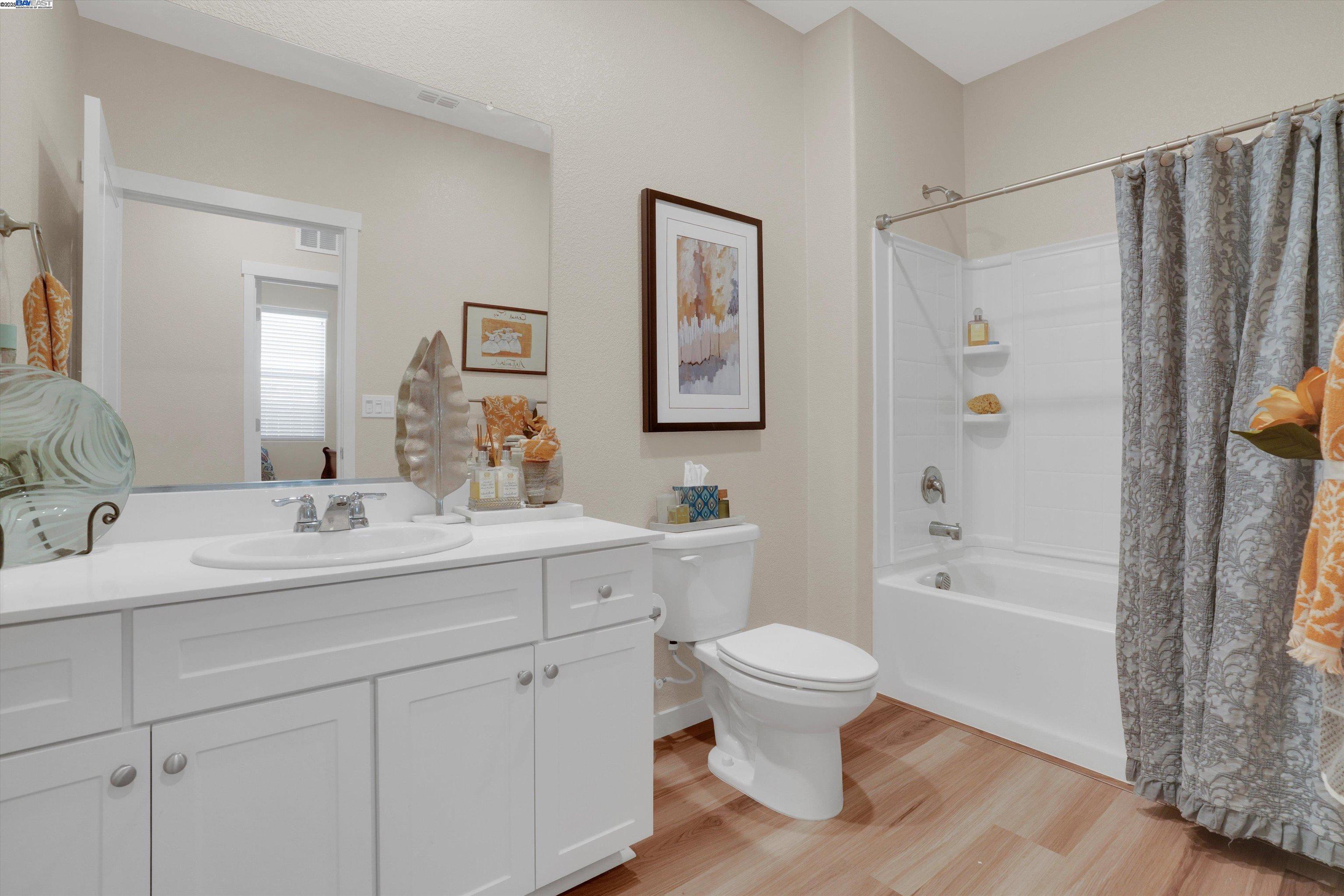 2211 Lavender Place Rio Vista, CA 94571 - Photo 23 of 36 a bathroom with a double vanity sink toilet and shower