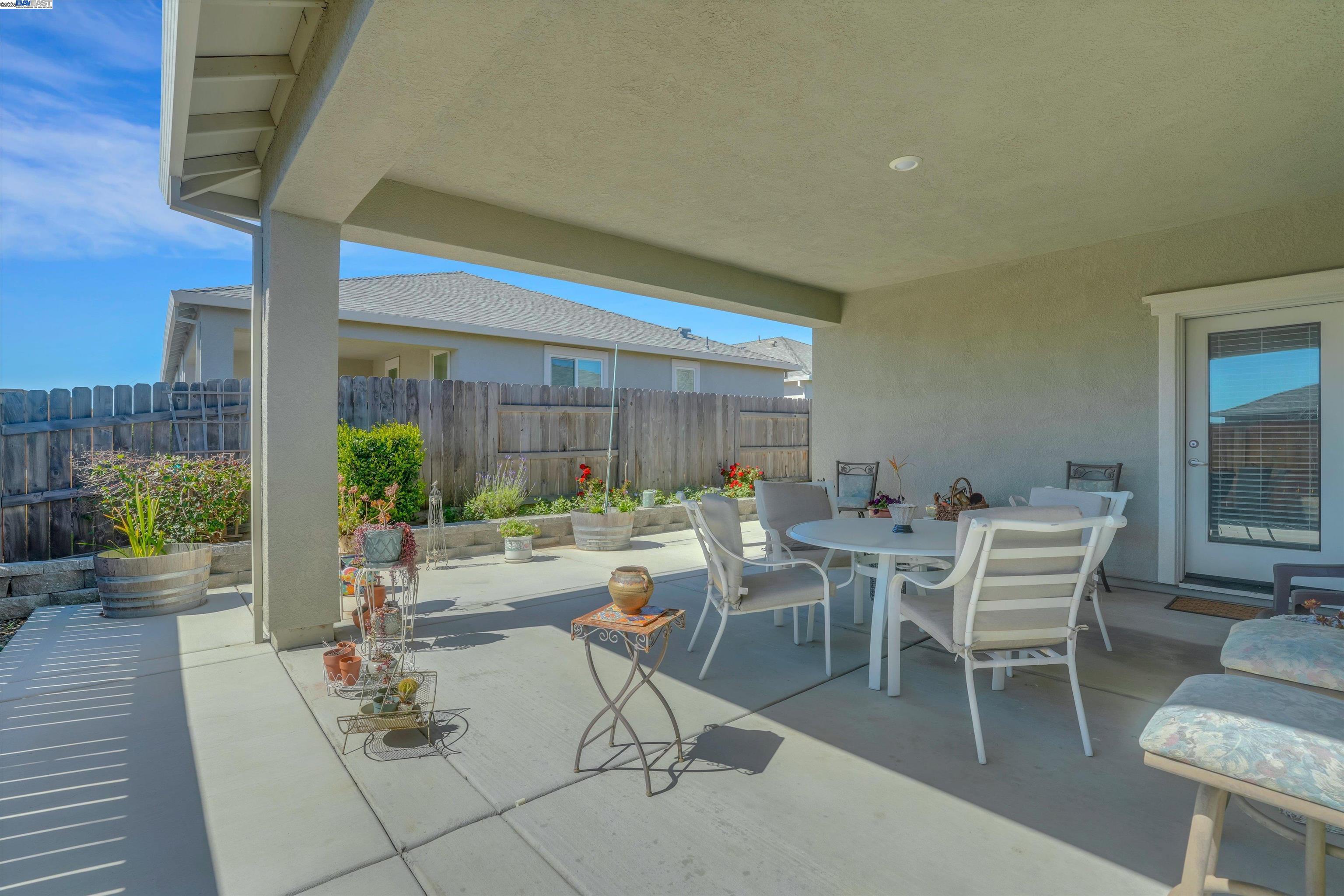2211 Lavender Place Rio Vista, CA 94571 - Photo 31 of 36 a view of a patio with table and chairs and potted plants