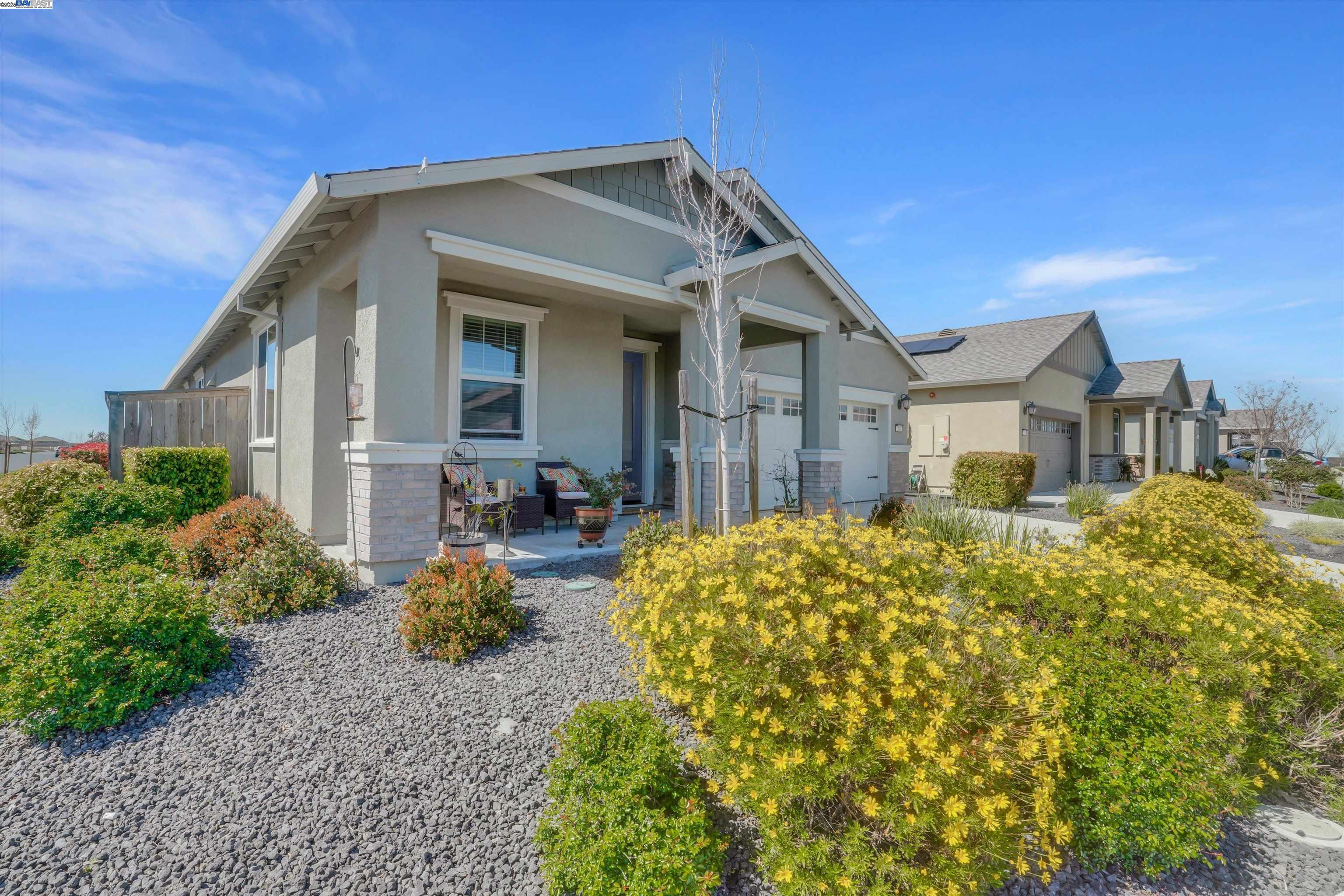 2211 Lavender Place Rio Vista, CA 94571 - Photo 5 of 36 a front view of a house with garden