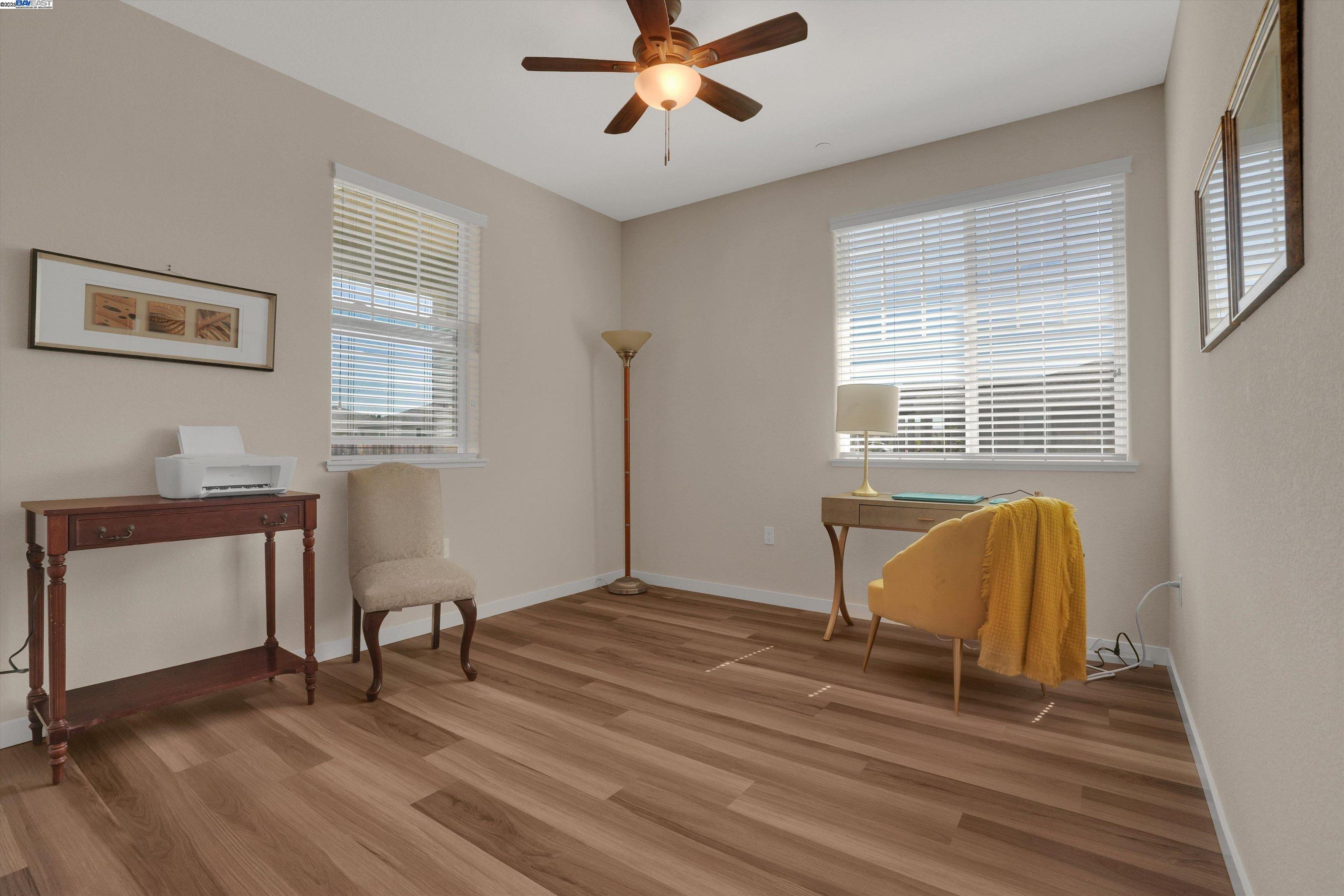 2211 Lavender Place Rio Vista, CA 94571 - Photo 6 of 36 a workspace with wooden floor windows and a chandelier fan
