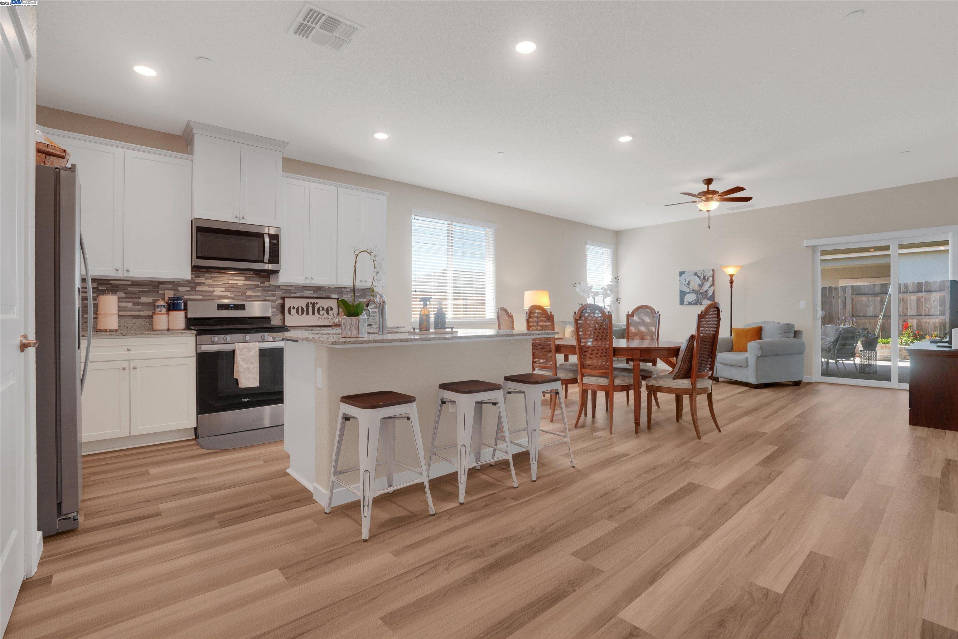 2211 Lavender Place Rio Vista, CA 94571 - Photo 10 of 36 a open kitchen with white cabinets and stainless steel appliances