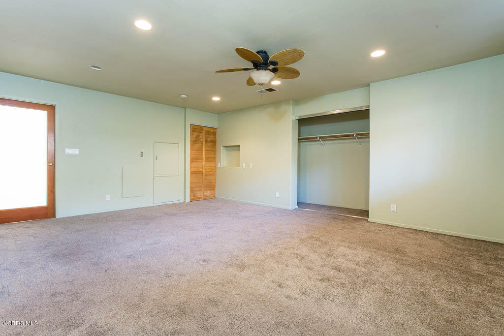 5051 Island View Street Oxnard, CA 93035 - Photo 12 of 38 an empty room with a ceiling fan and window
