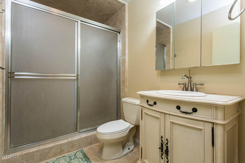 5051 Island View Street Oxnard, CA 93035 - Photo 18 of 38 a view of bathroom with a sink and mirror