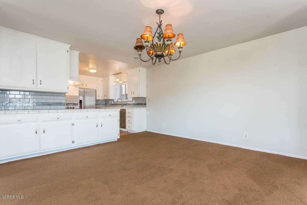 5051 Island View Street Oxnard, CA 93035 - Photo 19 of 38 a kitchen with a sink cabinets and a window