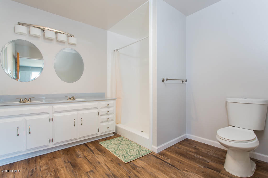 5051 Island View Street Oxnard, CA 93035 - Photo 25 of 38 a bathroom with a toilet sink and mirror