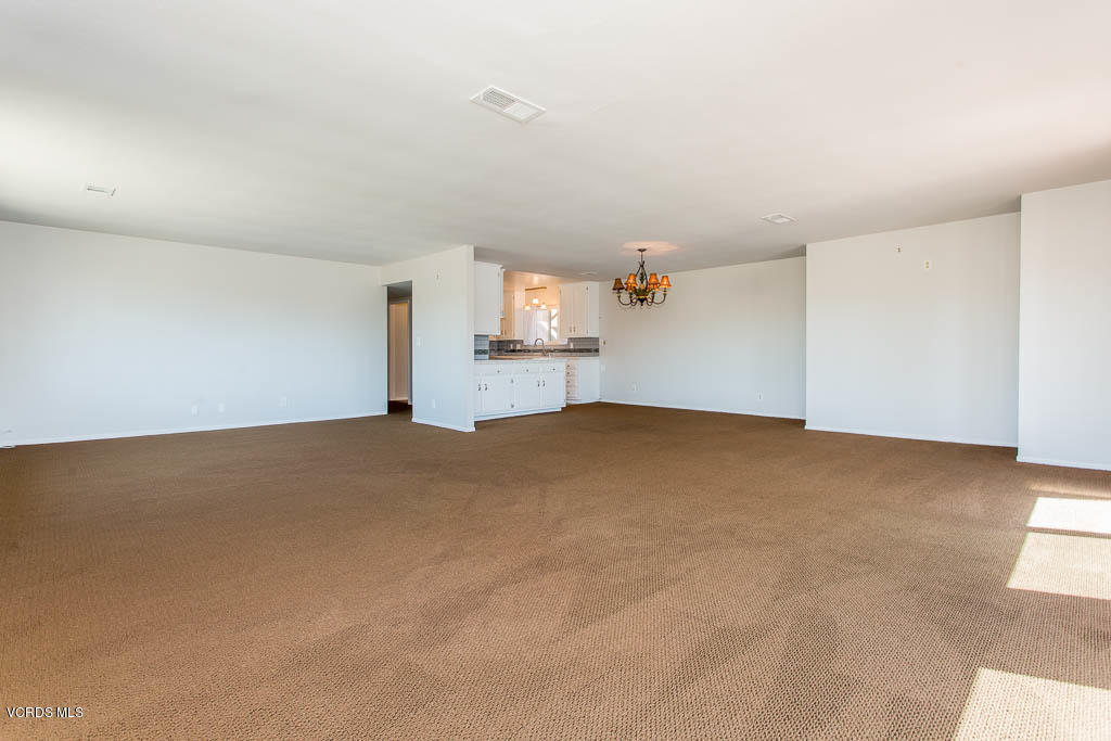 5051 Island View Street Oxnard, CA 93035 - Photo 10 of 38 a view of empty room with wooden floor