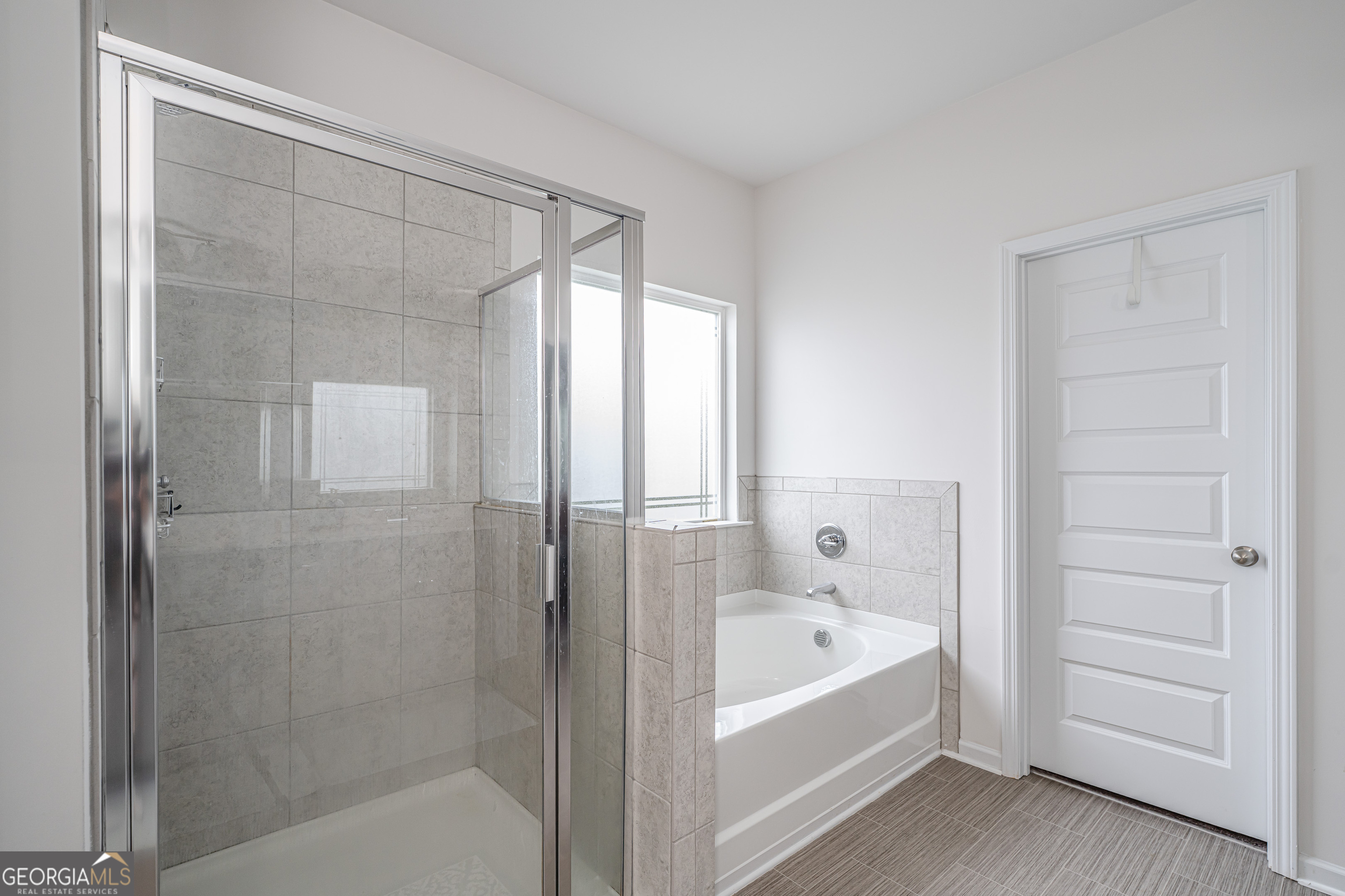 84 Royal Oak Drive Northeast Rome, GA 30165 - Photo 17 of 27 a bathroom with a bathtub and a shower