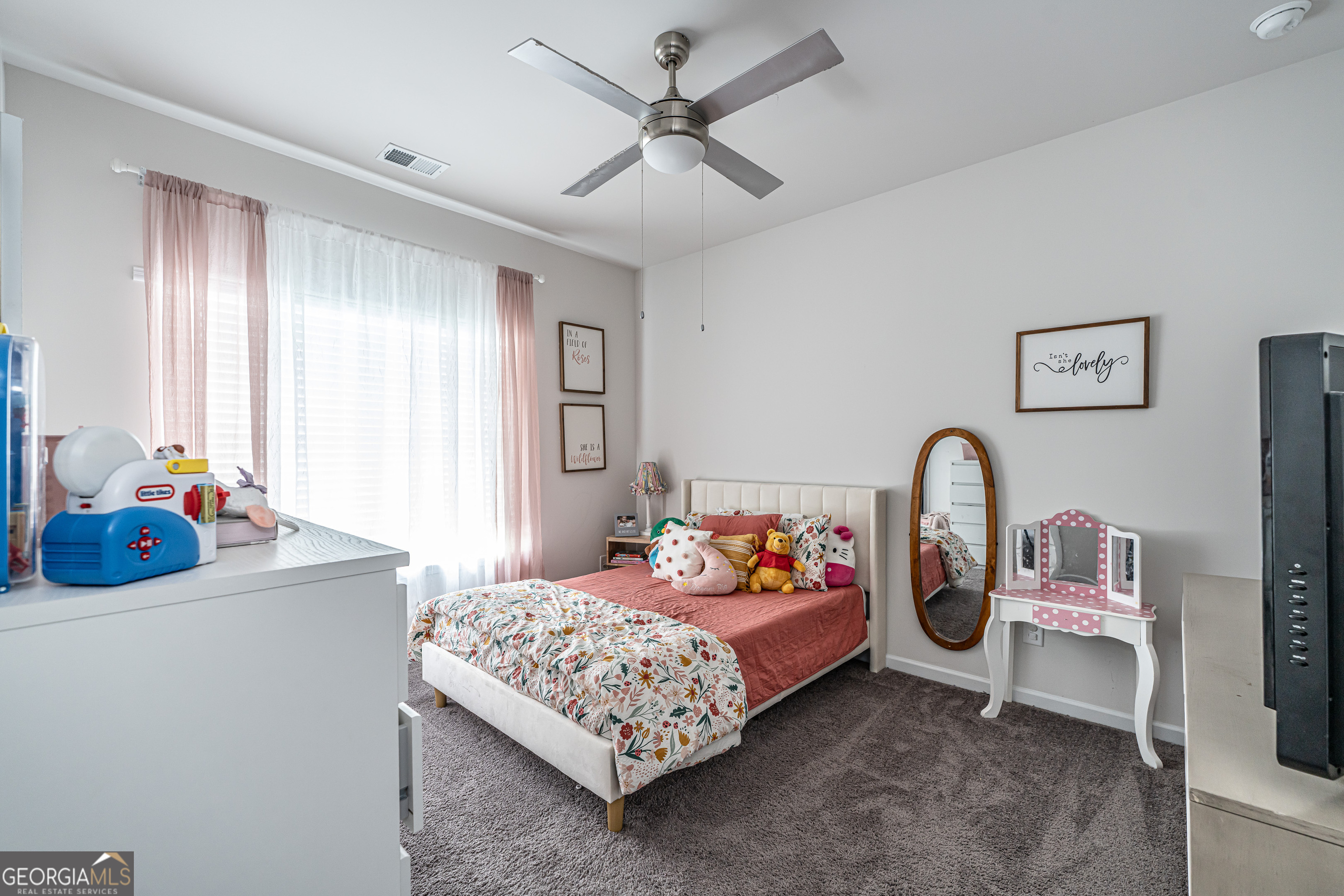 84 Royal Oak Drive Northeast Rome, GA 30165 - Photo 18 of 27 a bedroom with bed and a chandelier