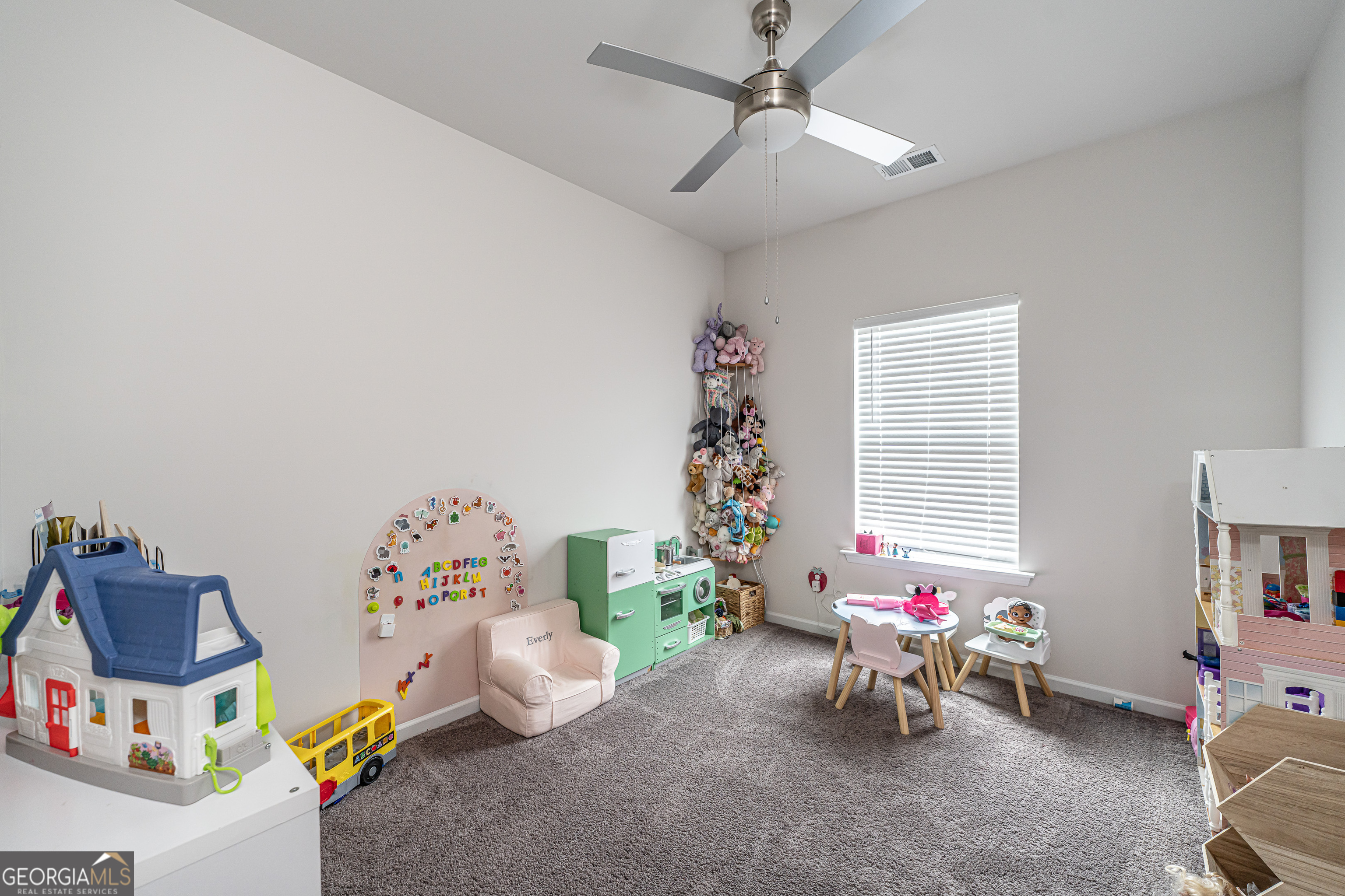 84 Royal Oak Drive Northeast Rome, GA 30165 - Photo 21 of 27 a bedroom with furniture and a window