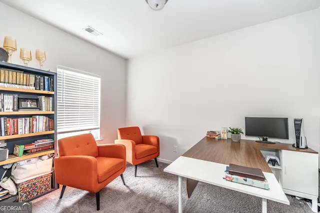 a room with furniture and a book shelf
