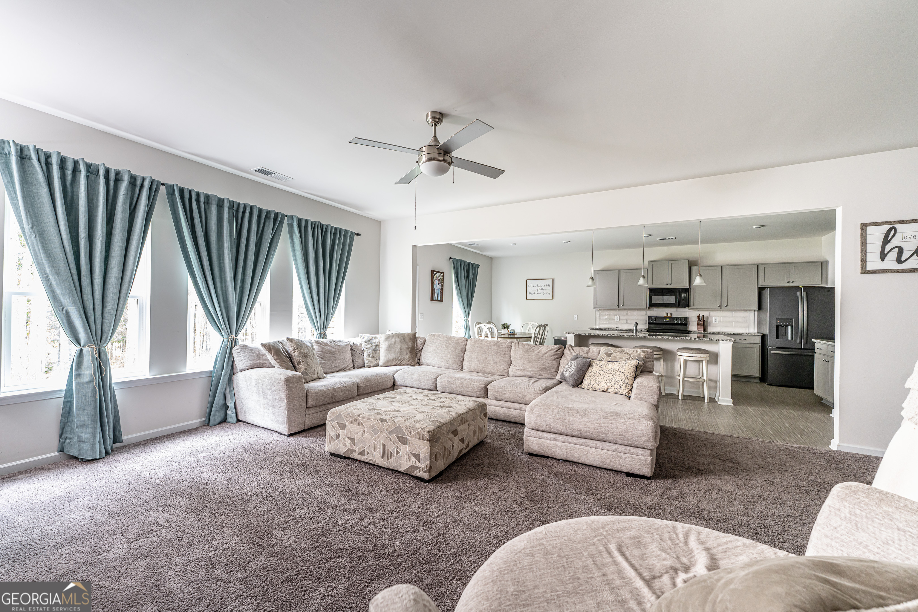 84 Royal Oak Drive Northeast Rome, GA 30165 - Photo 5 of 27 a living room with furniture and a large window