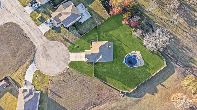 an aerial view of a house with a ocean view
