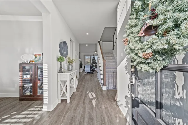 a view of entryway with livingroom and wooden floor