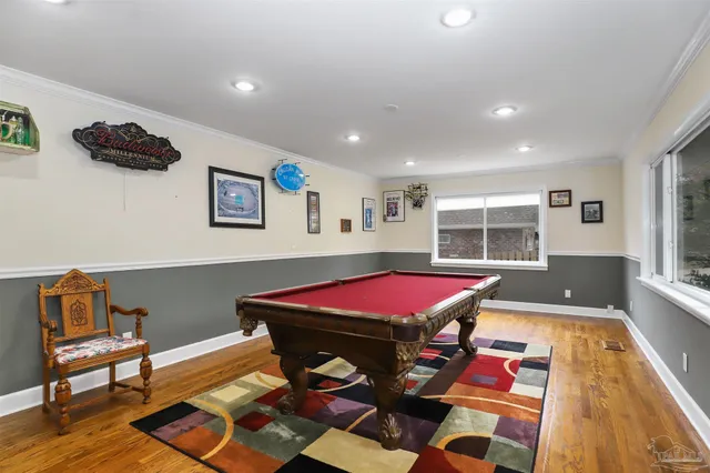 a living room with a piano and a table