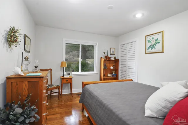 a bedroom with a bed and a table in it