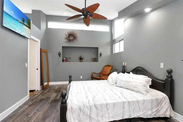 a bedroom with bed and window