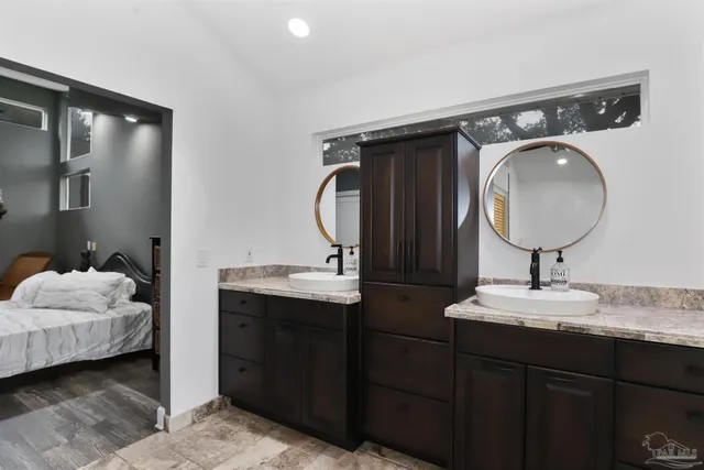 a en suite bathroom with a sink and a mirror