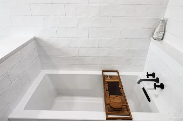 a bathroom with a bath tub