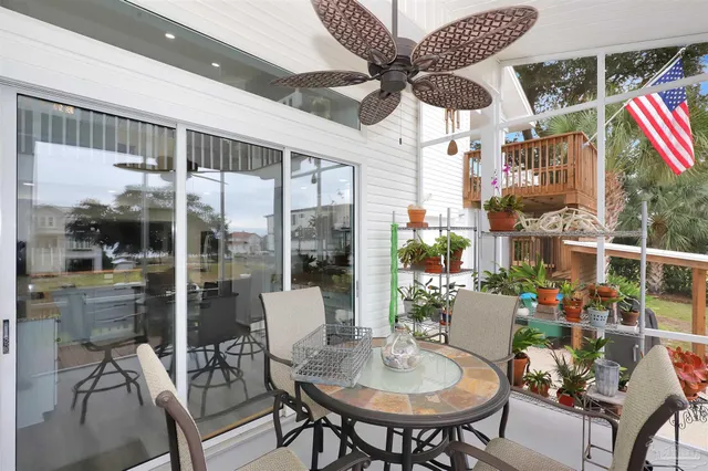 a outdoor dining space with furniture and a potted plant