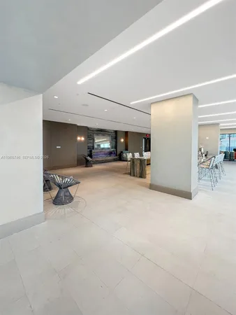 a dining room with furniture and a view of kitchen