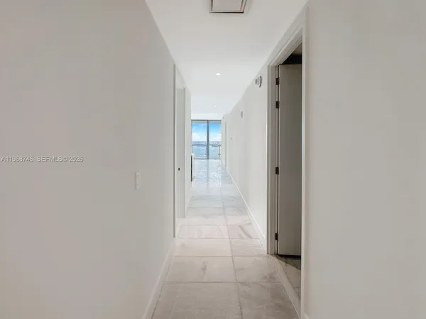 a view of an empty room with a stove