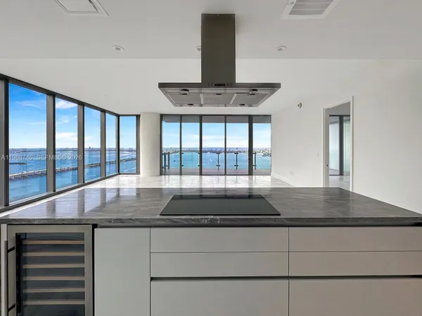 an empty room with sliding glass door