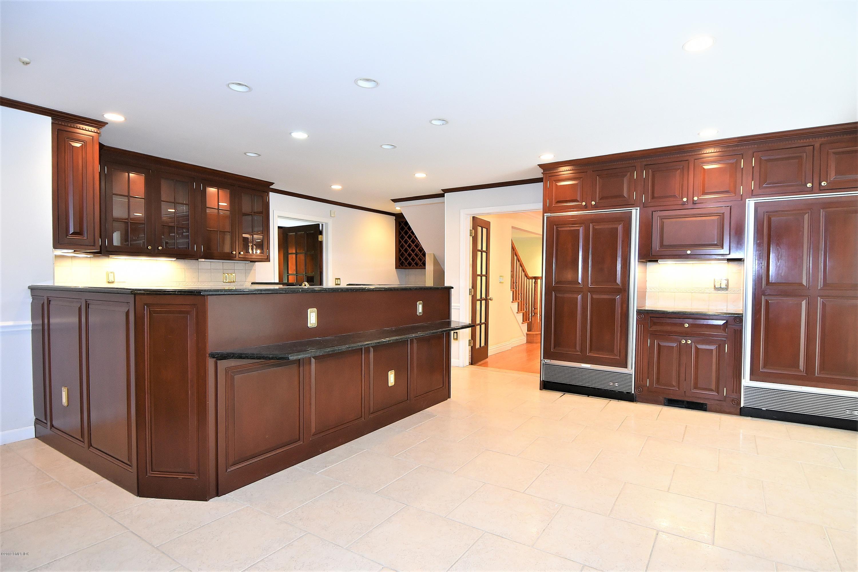 1 Tinker Lane Greenwich, CT 06830 - Photo 13 of 30 a kitchen with stainless steel appliances a refrigerator and a sink
