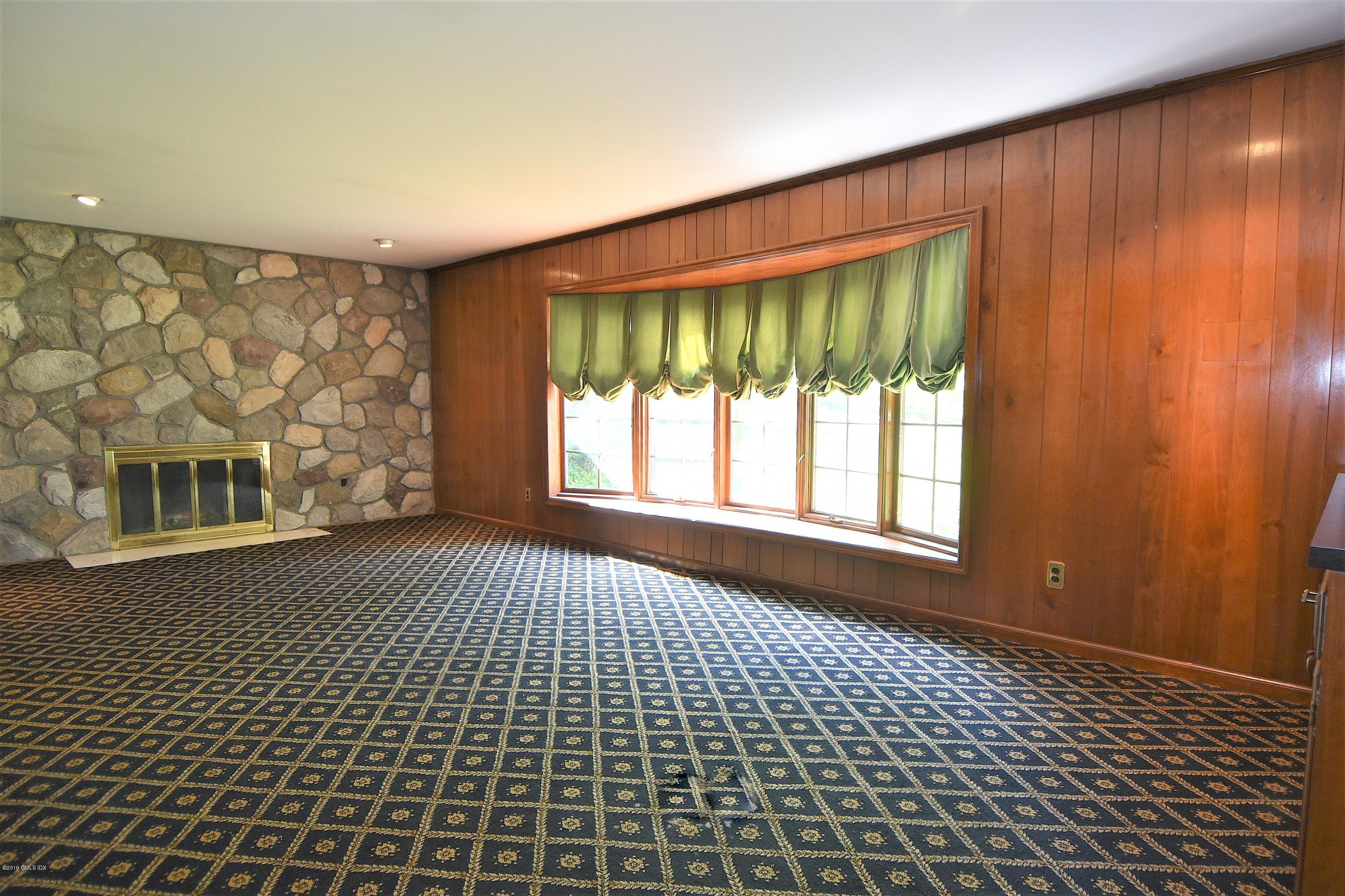 1 Tinker Lane Greenwich, CT 06830 - Photo 16 of 30 a big room with windows