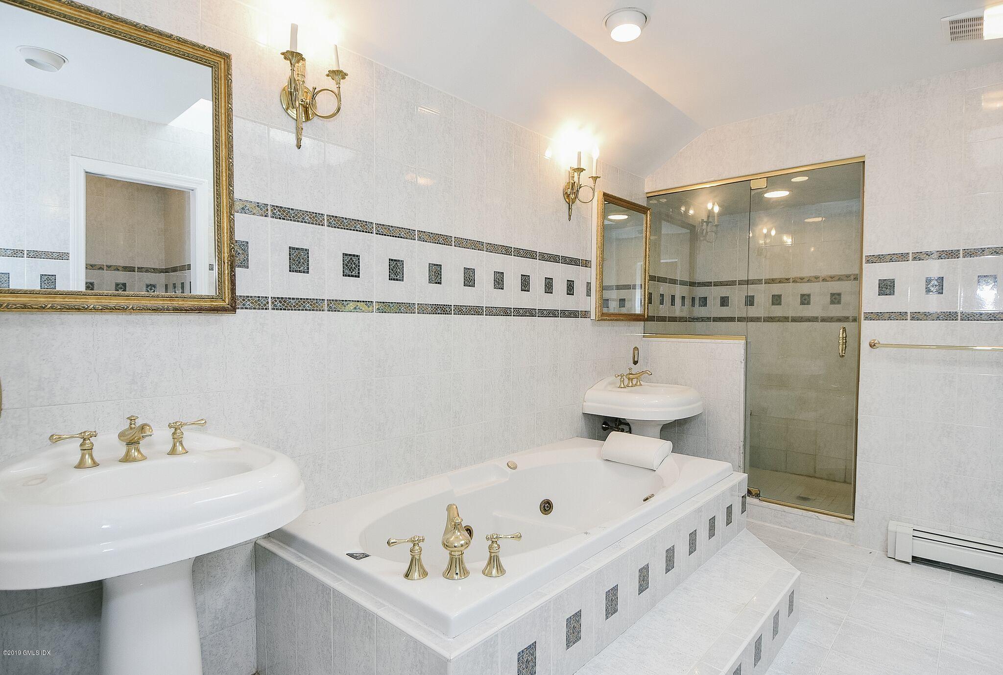 1 Tinker Lane Greenwich, CT 06830 - Photo 19 of 30 a bathroom with a sink and a bathtub