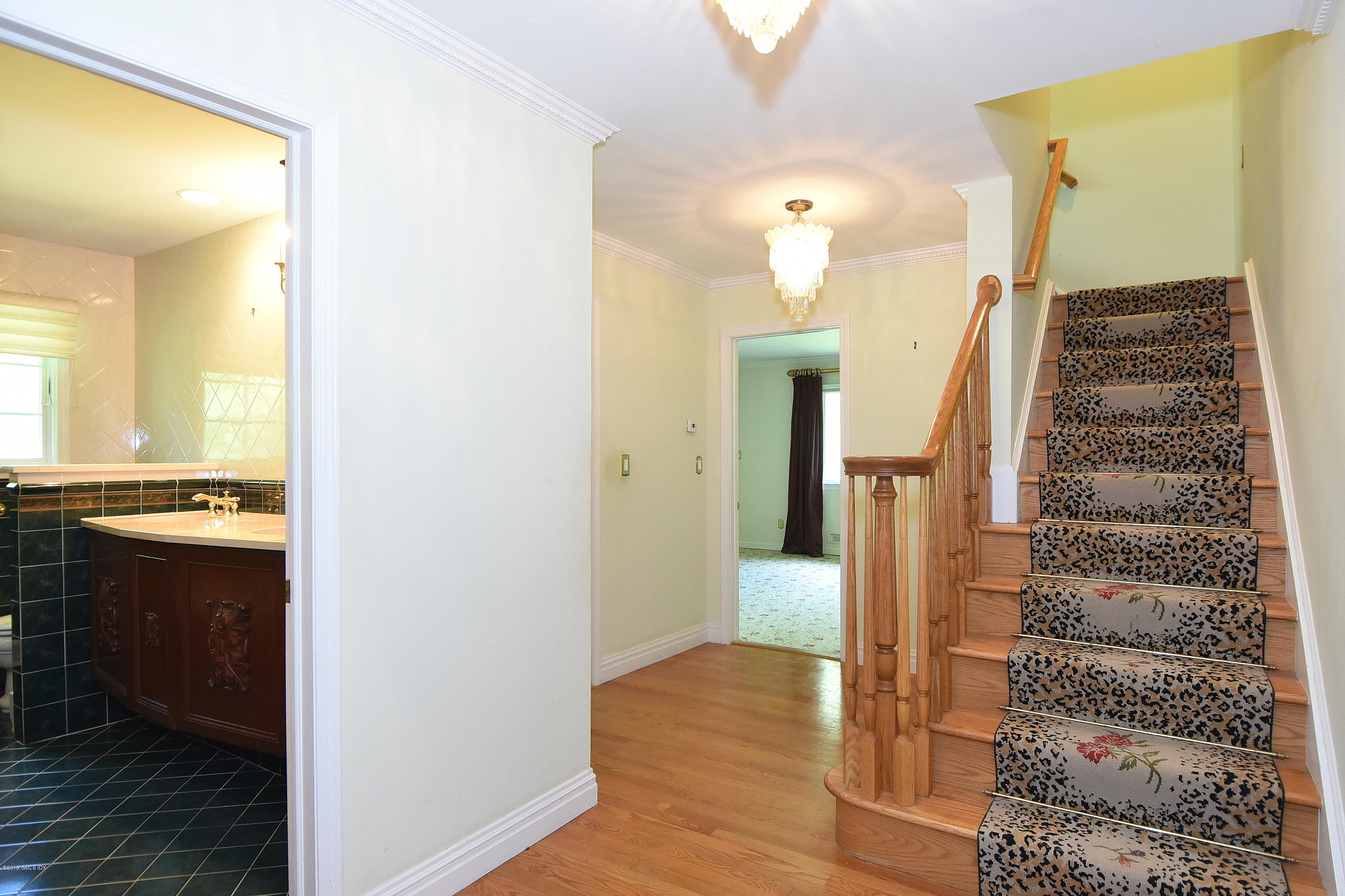1 Tinker Lane Greenwich, CT 06830 - Photo 21 of 30 a view of a bathroom with a sink and a mirror
