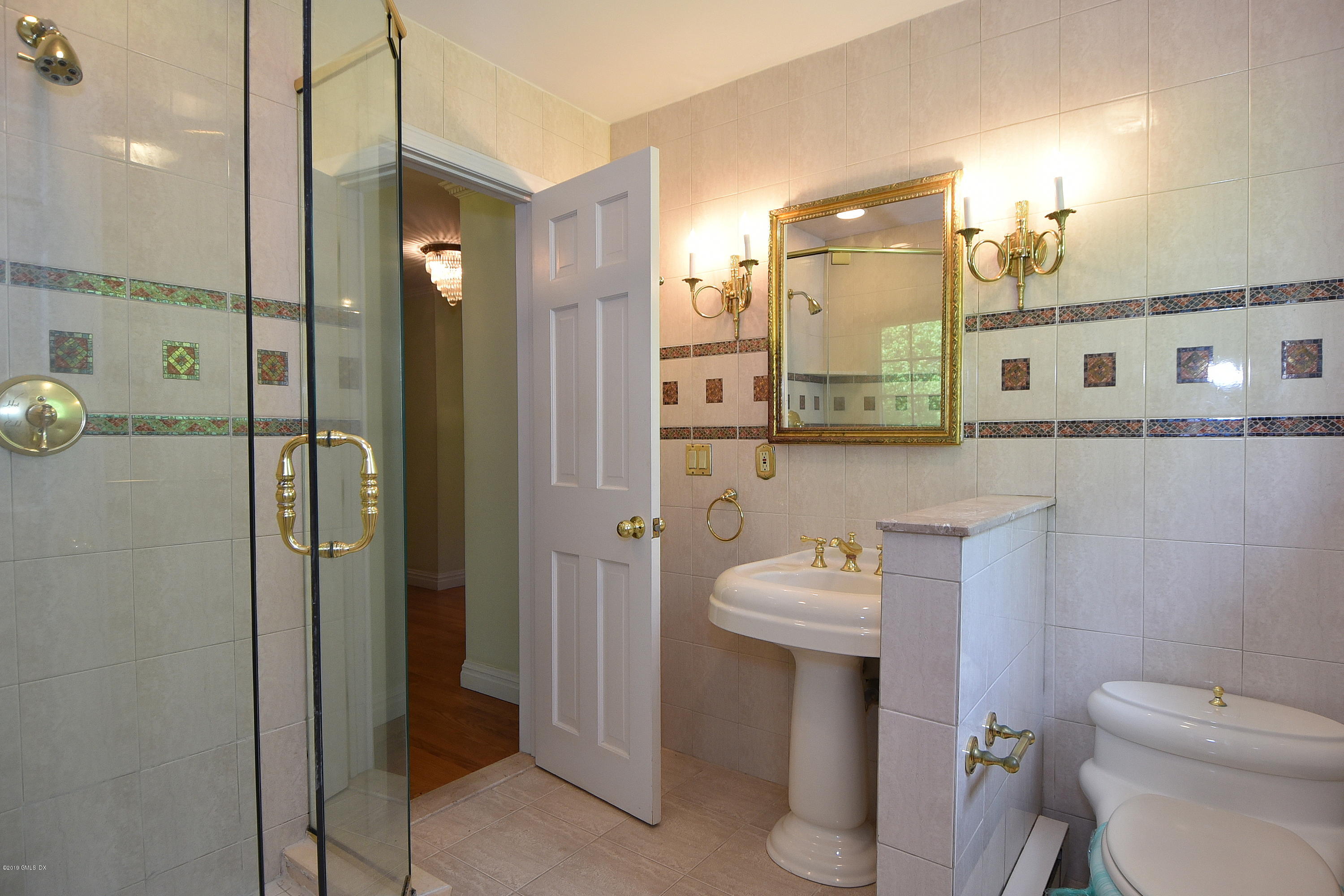 1 Tinker Lane Greenwich, CT 06830 - Photo 23 of 30 a bathroom with a sink a toilet and shower