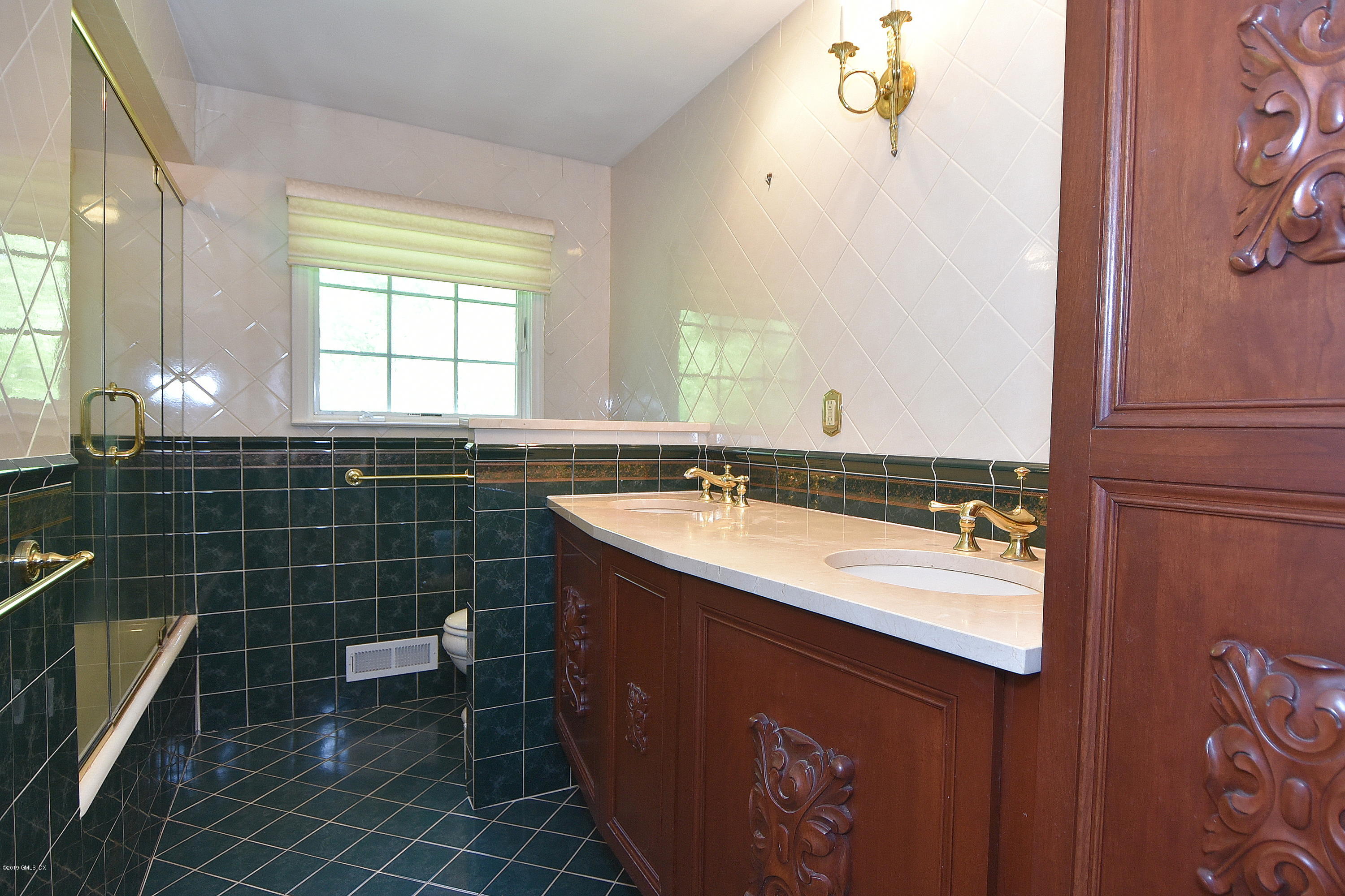 1 Tinker Lane Greenwich, CT 06830 - Photo 26 of 30 a bathroom with a sink and a mirror